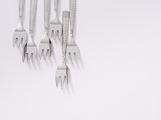 silverware forks spoons knives cutlery on a white background