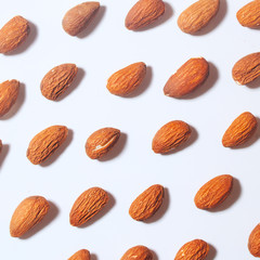 Top view almond set on white background, Abstract background with Almond pattern. Composition of nuts. Concepts about decoration, healthy eating and food background. Flat lay, top view Minimal concept