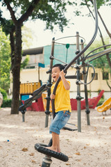 Kids playing with park play equipment