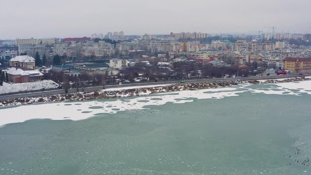 Air view with various birds of the Pitesti lake on the Arges river..