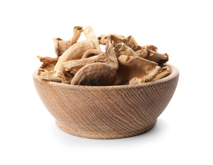 Bowl of dried mushrooms isolated on white