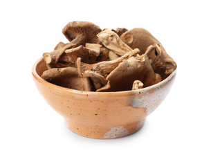 Bowl of dried mushrooms isolated on white