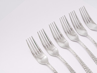 silverware forks spoons knives cutlery on a white background