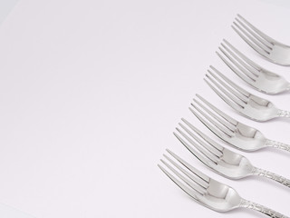 silverware forks spoons knives cutlery on a white background