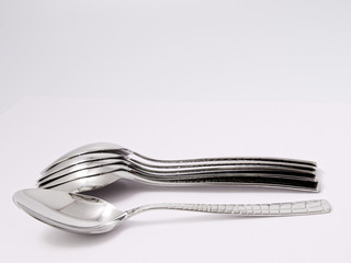 silverware forks spoons knives cutlery on a white background