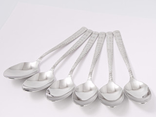 silverware forks spoons knives cutlery on a white background