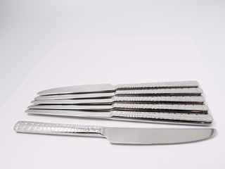 silverware forks spoons knives cutlery on a white background