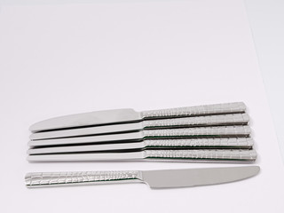 silverware forks spoons knives cutlery on a white background
