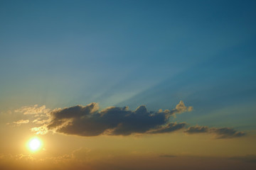 light rays of sun above clear blue sky