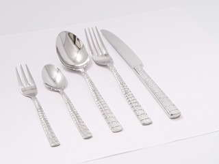 silverware forks spoons knives cutlery on a white background