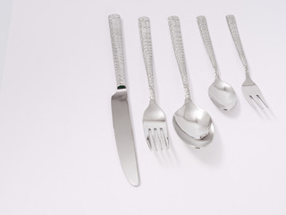 silverware forks spoons knives cutlery on a white background