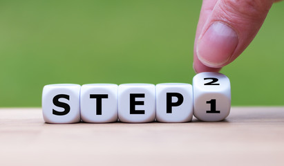 Step by step. Hand flips a dice and changes the number 1 to number 2