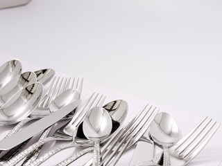 silverware forks spoons knives cutlery on a white background