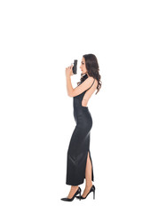 beautiful female killer in black dress holding gun, isolated on white