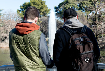 A dad and his son looking at a fountain