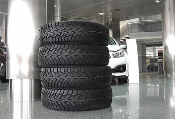 Stacking tires in front of vehicle at the car service station