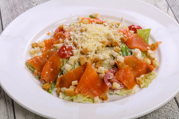 Caesar salad with salmon and parmesan