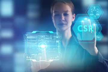The concept of business, technology, the Internet and the network. A young entrepreneur working on a virtual screen of the future and sees the inscription: CSR