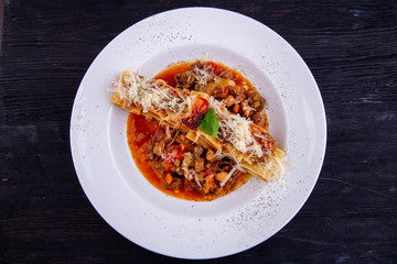 Ragout from a lamb with olives, a sage and tomatoes, pekorino and garlic