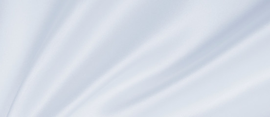 Smooth elegant grey silk or satin luxury cloth as wedding background. Luxurious background design