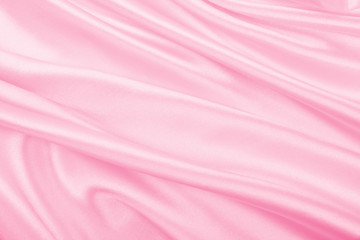 Smooth elegant pink silk or satin texture as wedding background. Luxurious valentine day background...