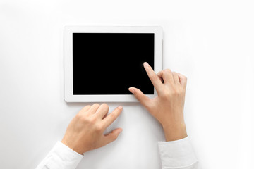 The businessman's hand uses a tablet. Isolated on a blank white background ,top view