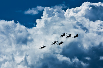 Terrible and dangerous silhouettes of Russian jet military aircraft in the sky.
