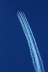 military aircraft at airshows in the sky. The link of Russian military aircraft in the  sky leaves smoky traces.