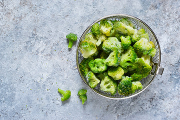 Frozen broccoli on a concrete background with space for text, healthy diet food. view from above
