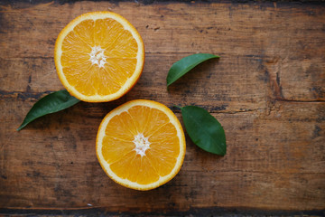 Fototapeta na wymiar orange slices on wooden background