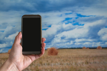 Internet of things(agriculture concept),smart farming,industrial agriculture.Farmer point hand to use augmented reality technology to control ,monitor and management in the farm