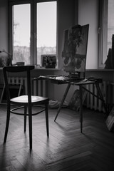 Various artist equipment in the workshop studio. Black and white picture. Natural daylight.