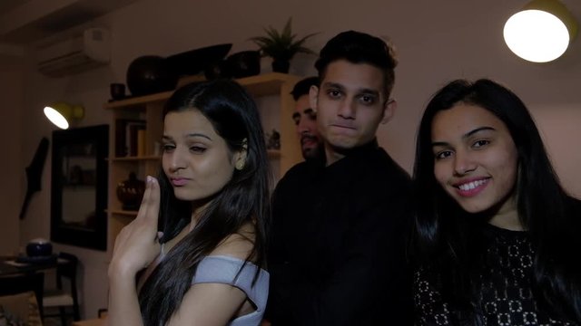 Confident Young Urban Couple Friends Pose With Each Other As They Get Ready For A Photograph Being Taken By The Camera Pov Interior Home