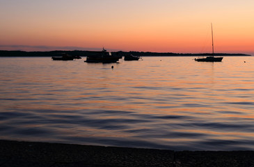 Fototapeta na wymiar sunset with boats in Fazana, Croatia
