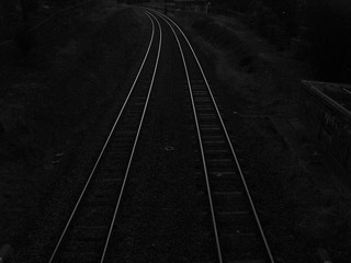 Naklejka na ściany i meble Rail tracks of train at sunset. US railway