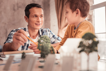 Blonde-haired adopted son asking his father about trees