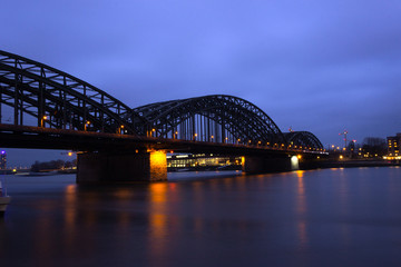 Naklejka premium View of the old Hohenzollern Bridge, the Skyline and a bright, Cologne at Night - Germany, Cologne 2019