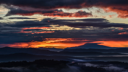 Silhouette cloudy sunset mountain fog