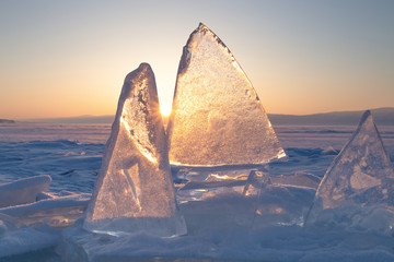 Colorful sunset over the crystal ice of Baikal lake