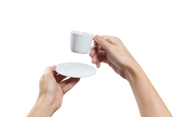 Hands holding a small cup of coffee or tea, isolated on white background