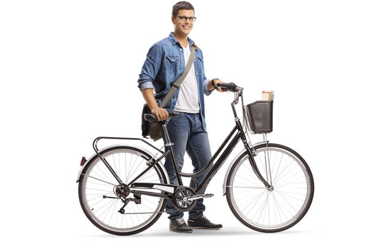 Casual young man standing with a bicycle