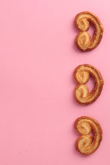 Puff pastry cookies on colorful background