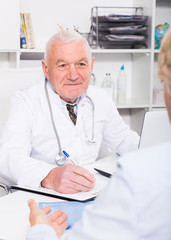 Male doctor with female client