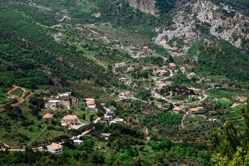 Fototapeta na wymiar Faraya valley and village with scattered houses shot from the hill. Lebanon