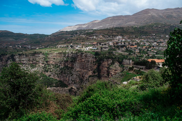 Obraz premium Faraya valley and village with scattered houses shot from the hill. Lebanon