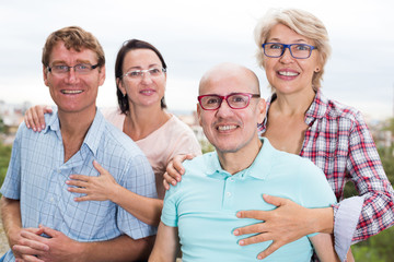 smiling mature people in glasses