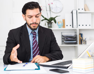 Man employee is indignant because he is having issues with project