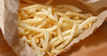 French fries inside paper bag