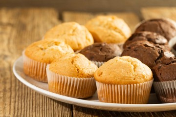 Chocolate cake and nut cake, homemade cakes on wooden background