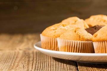 Chocolate cake and nut cake, homemade cakes on wooden background